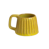 Handcrafted ceramic mug with an iridescent yellow glaze, radiating warmth and cheer. Its smooth, rounded shape and bright finish make it the perfect companion for sunny mornings and golden hours.