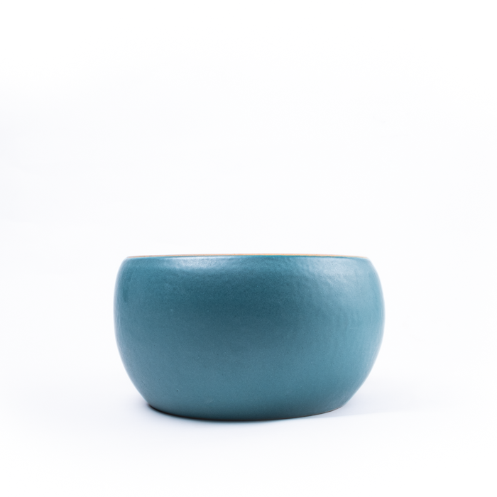 Large handcrafted stoneware serving bowl with textured surface and artisanal design