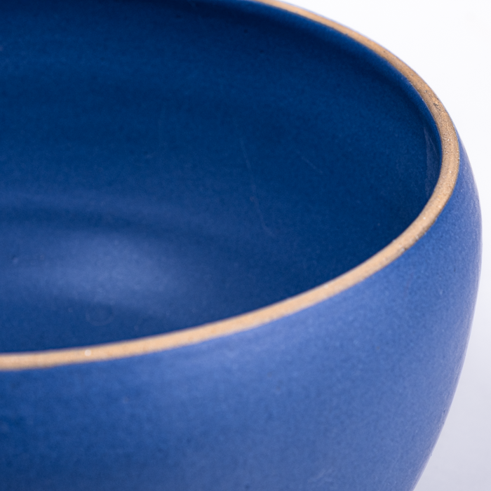 Large handcrafted stoneware serving bowl with textured surface and artisanal design