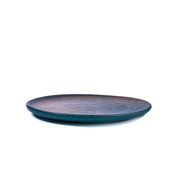 Medium handcrafted stoneware plate with textured surface and artisanal design
