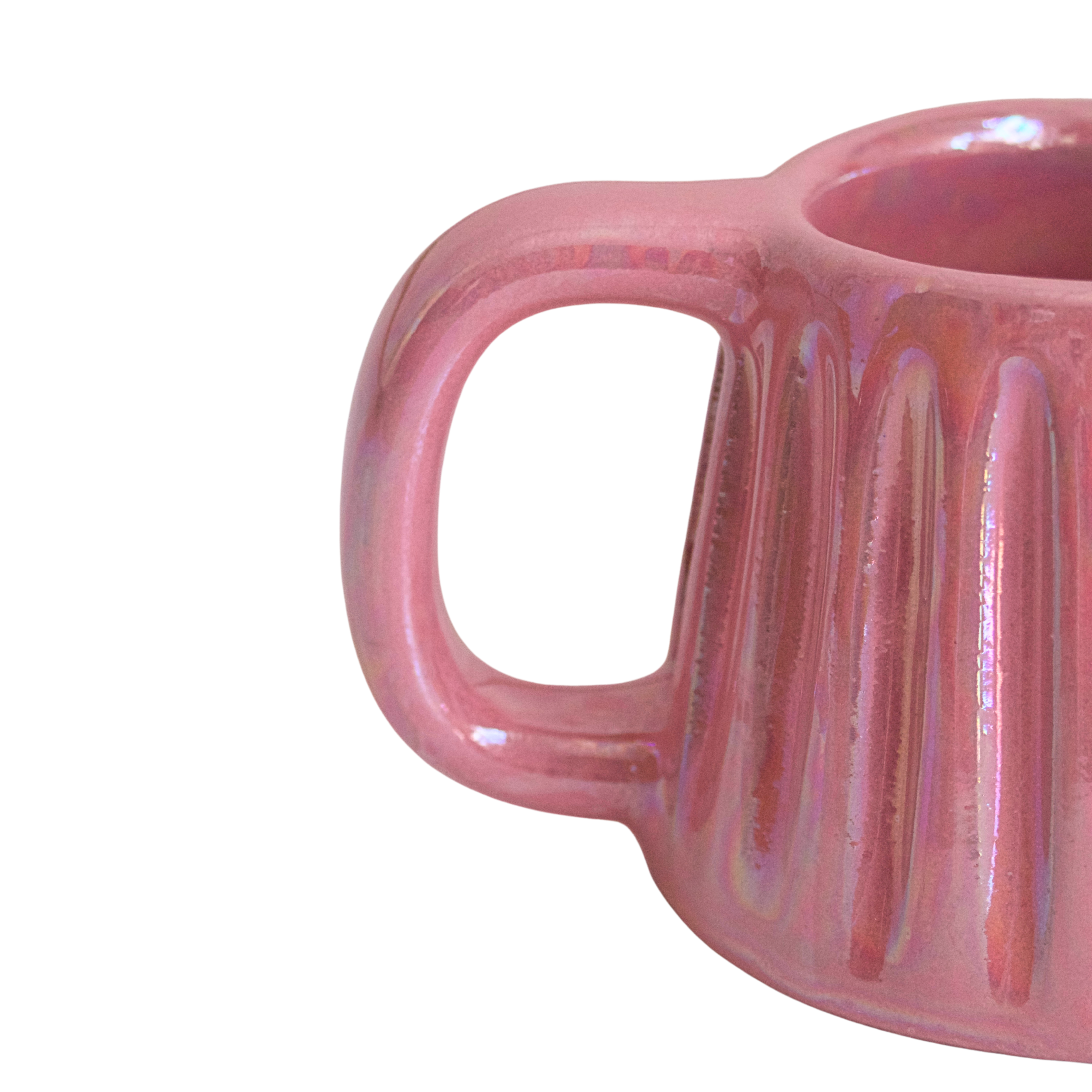 Handcrafted ceramic mug with an iridescent blush pink glaze, featuring a soft, rounded form and a comfortable handle. A warm, rosy glow that brings charm and calm to every sip.

