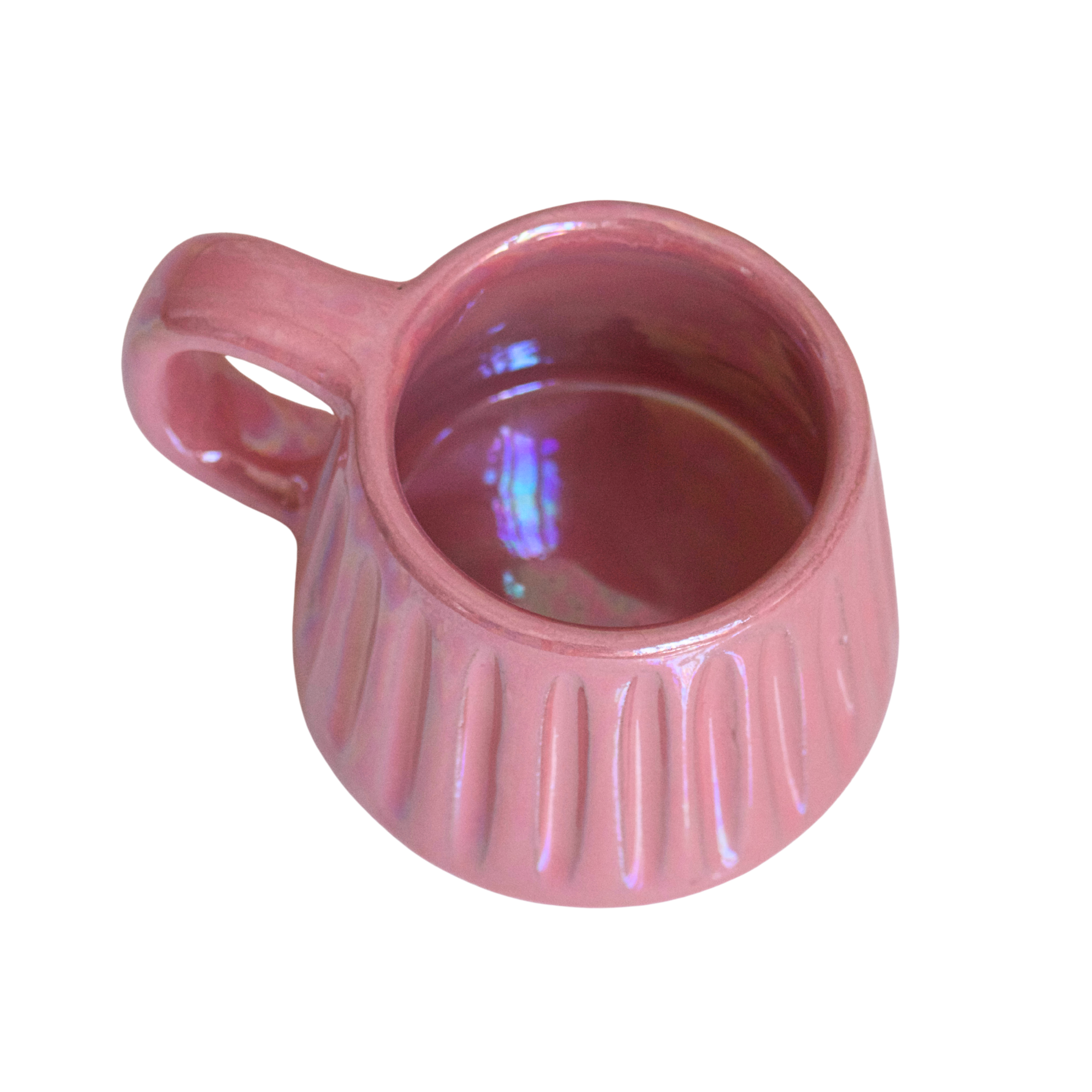 Handcrafted ceramic mug with an iridescent blush pink glaze, featuring a soft, rounded form and a comfortable handle. A warm, rosy glow that brings charm and calm to every sip.

