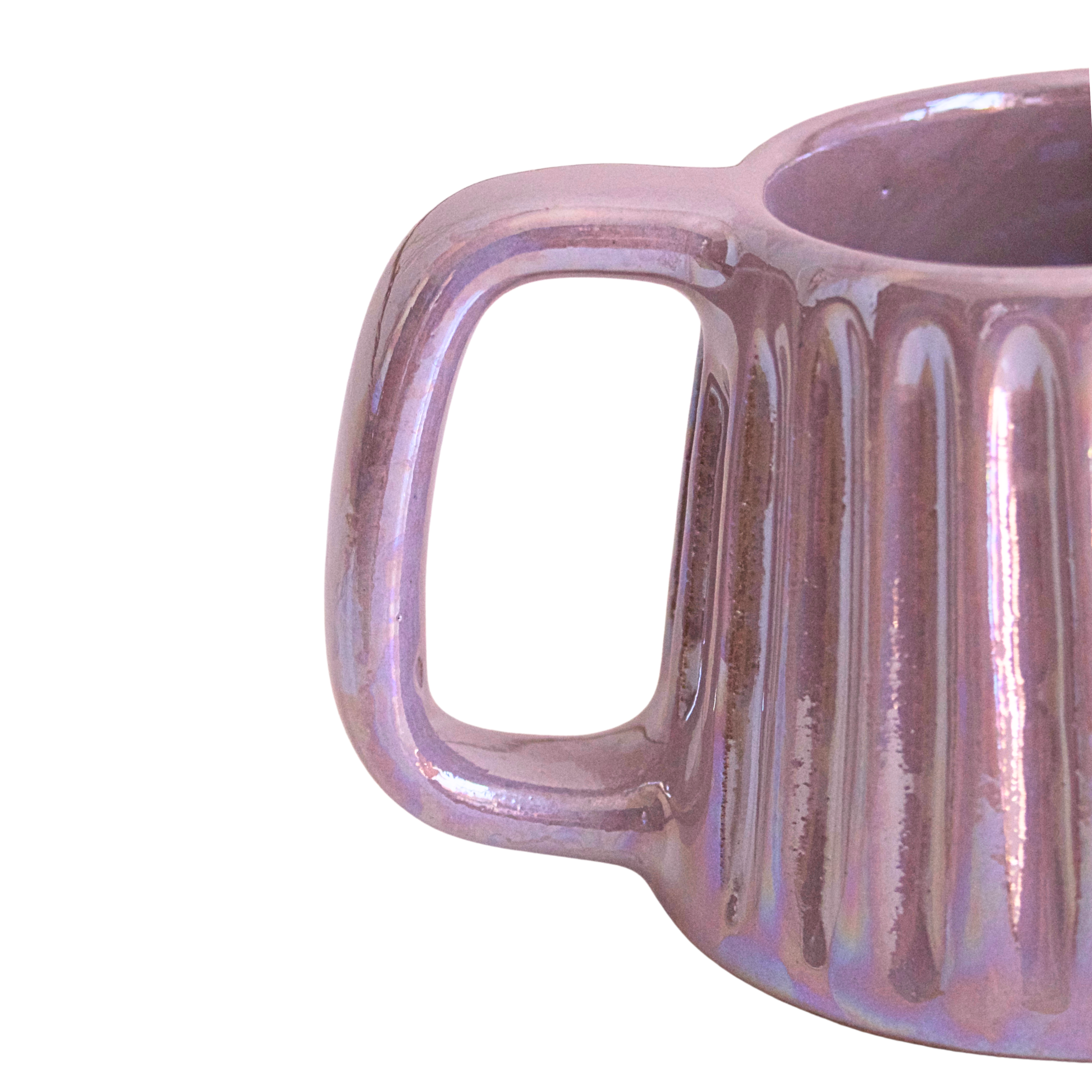 Handcrafted ceramic mug with an iridescent lavender glaze, blending soft purple tones with a subtle shimmer. Its soothing hue and elegant form bring calm and comfort to every sip.

