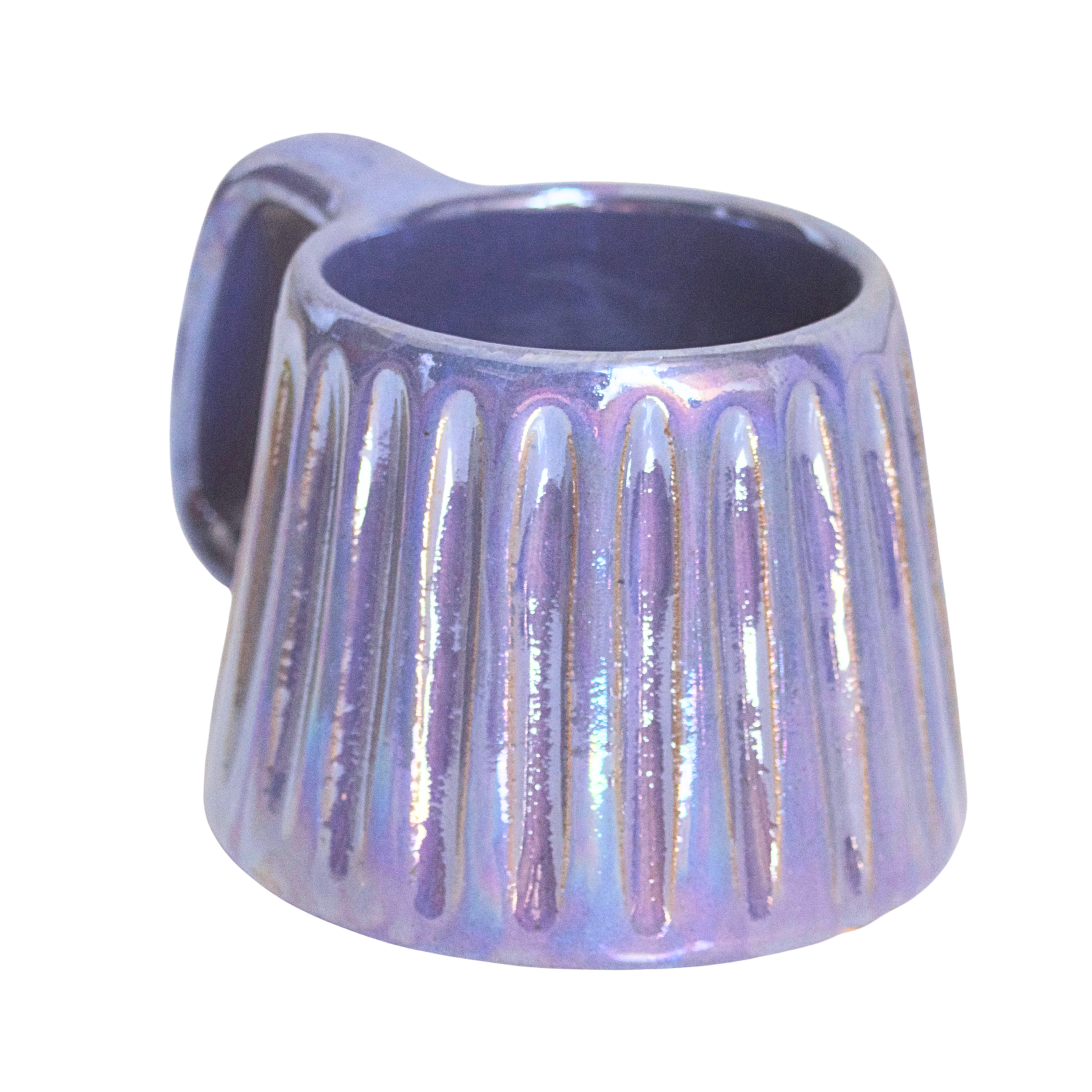 Handcrafted ceramic mug with an iridescent glaze in layered sea tones of blue and green, echoing ocean waves. Its organic shape and curved handle bring a calming, coastal vibe to every sip.

