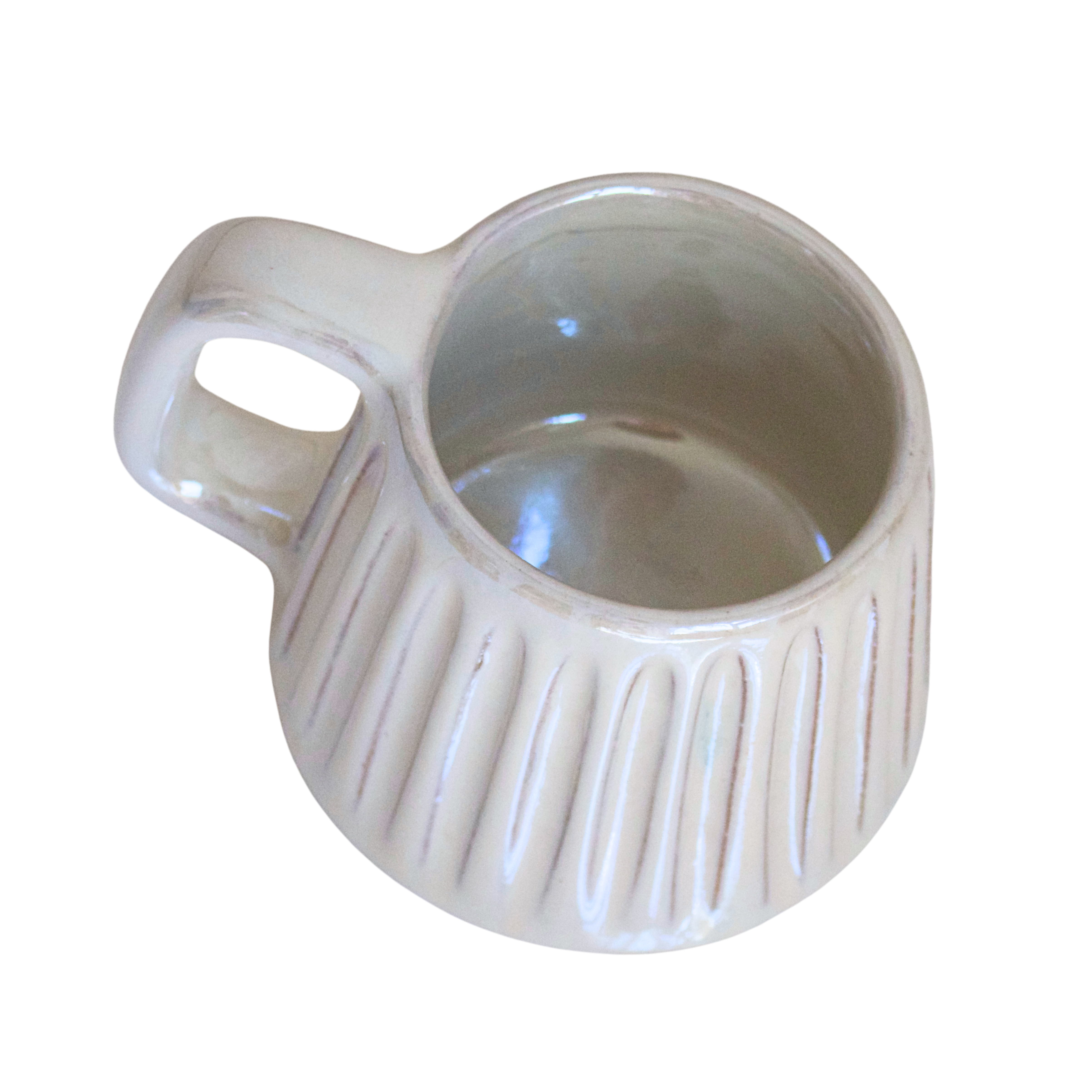 Handcrafted ceramic mug in a soft pearlescent white glaze, featuring a smooth, rounded shape and a minimalist handle. Perfect for elevating everyday rituals with a touch of elegance and simplicity.

