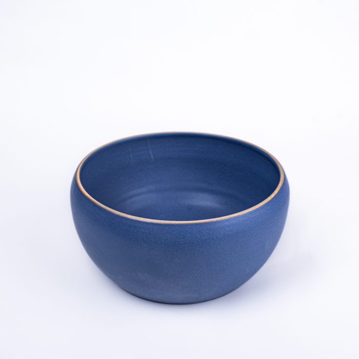 Large handcrafted stoneware serving bowl with textured surface and artisanal design