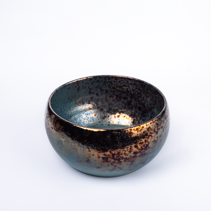 Large handcrafted stoneware serving bowl with textured surface and artisanal design