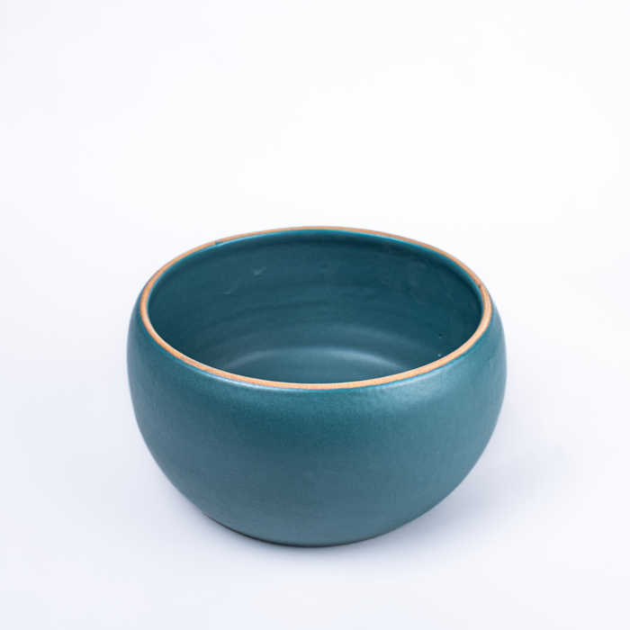Large handcrafted stoneware serving bowl with textured surface and artisanal design