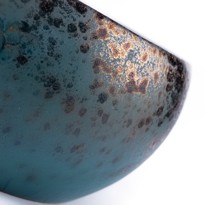 Large handcrafted stoneware serving bowl with textured surface and artisanal design